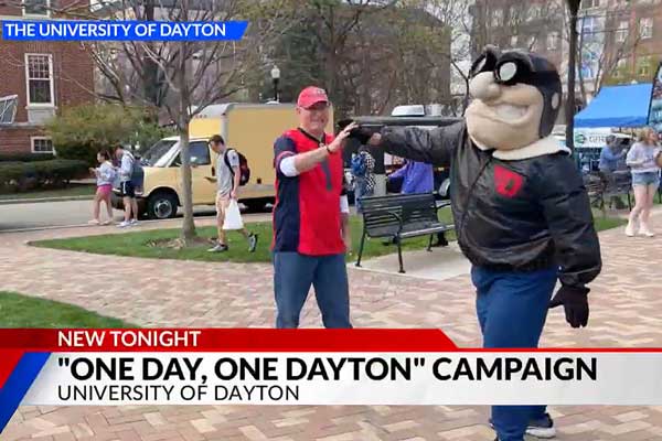WDTN-TV news story with President Spina and Rudy Flyer high-fiving