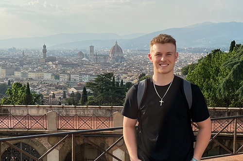 Jack in the foreground and  Florence, Italy in the background with the Duomo primarily in view