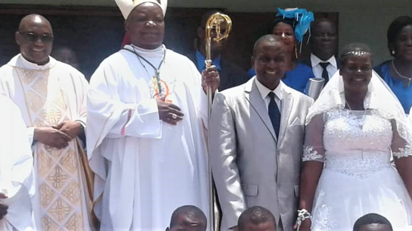 Benedict R. K. Nyondo with his wife Martha and the Bishop of the diocese.