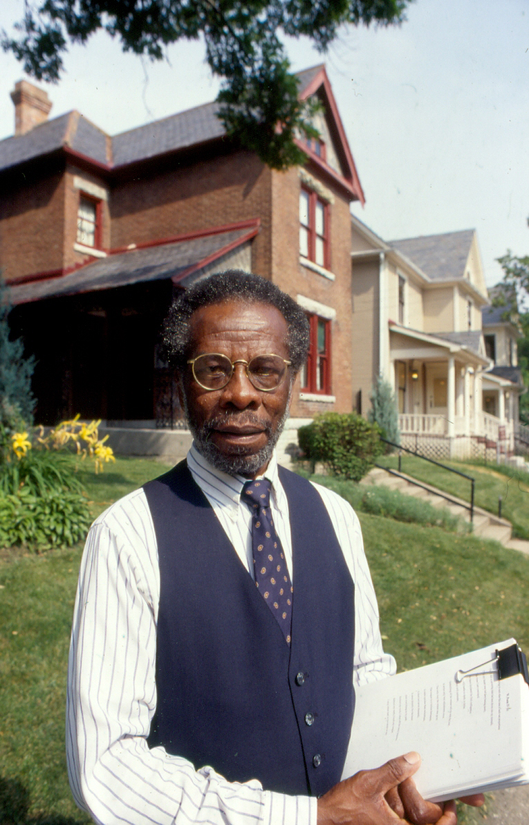 Herb Martin stands in front of the Dunbar House. Photo from University Archives.