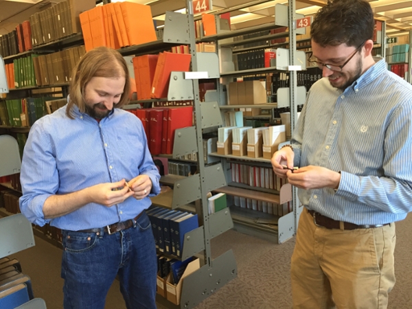 University Libraries application developer Ray Voelker and application support specialist Craig Boman solve puzzles.