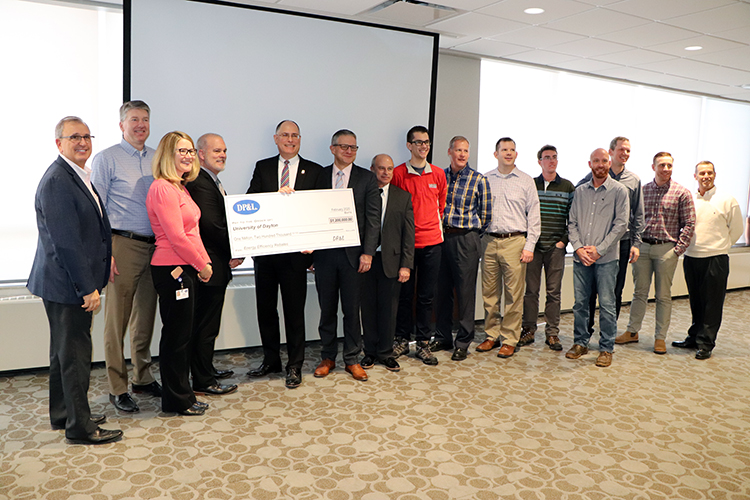 Dayton Power and Light officials presented a rebate check worth $1.2 million to the University of Dayton.