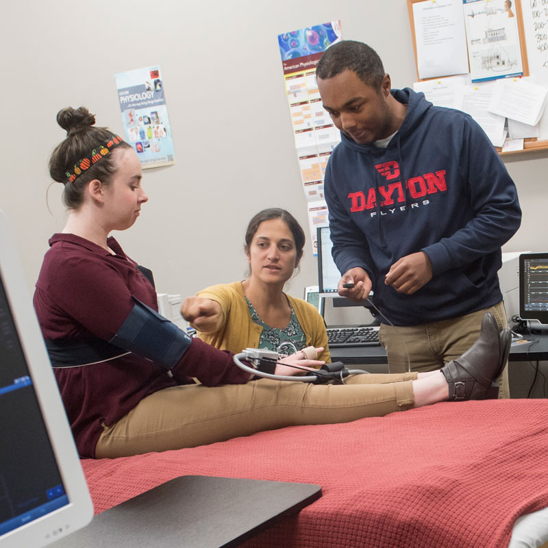 Students conduct research with a faculty member