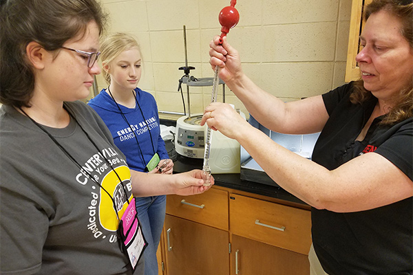 (r) Denise Taylor, professor, civil and environmental engineering, with WIE campers during Experiments in Engineering segment