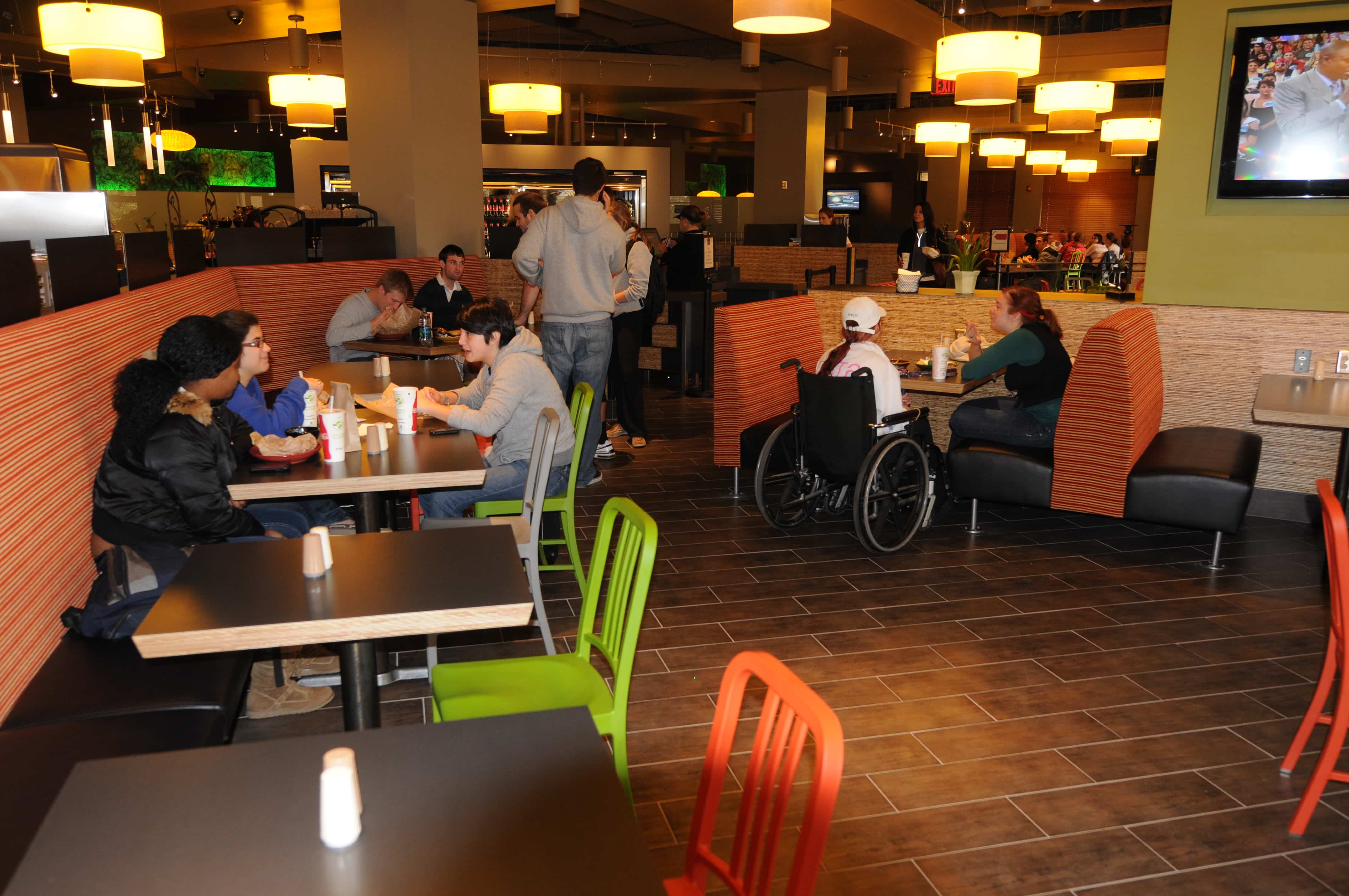 The Grainary has a large seating area with booths, tables and chairs and TV.