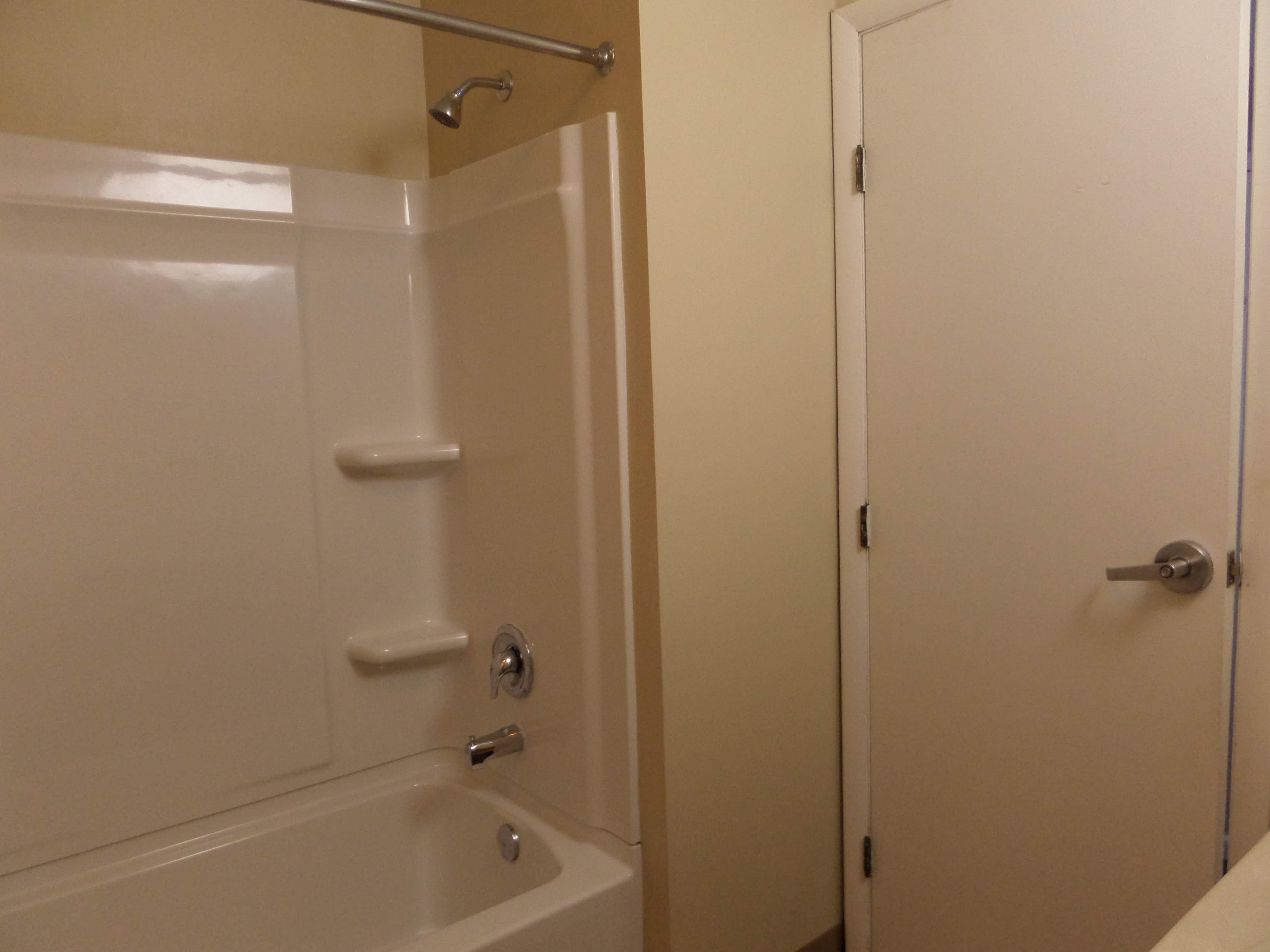 Shared bathroom has standard shower rail