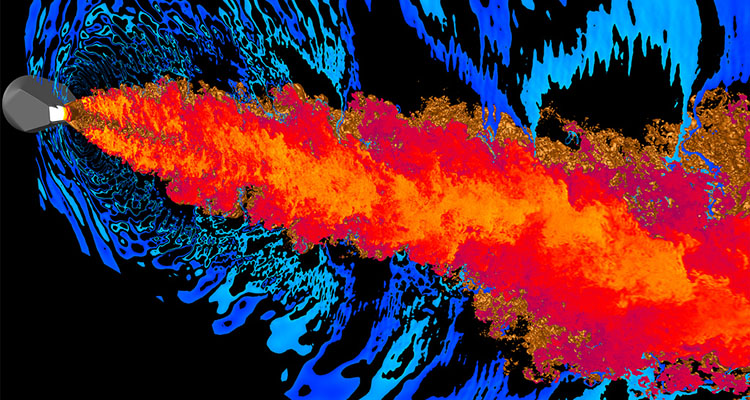 Computer-modeled image of supersonic jet exhaust. The rectangular nozzle is shown in gray with an isosurface of temperature (gold) cut along the center plane of the nozzle showing temperature contours (red/yellow). The acoustic field is visualized by (blue/cyan) contours of the pressure field taken along the same plane. Photo credit: Joseph Nichols, Center for Turbulence Research, Argonne National Laboratory